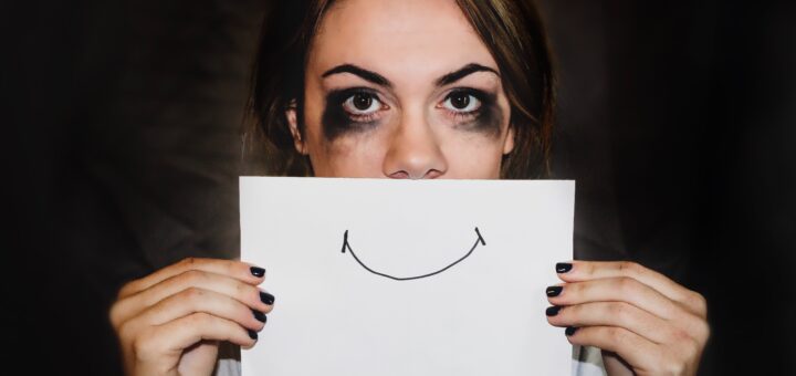 Caregiver with pasted on smile