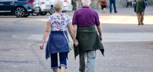 Older couple walking and holding hands