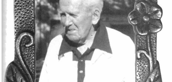 A vintage black and white photo of an old man in a gold shirt and sweater. He is my neighbor Joe taken from my book Minding Our Elders.