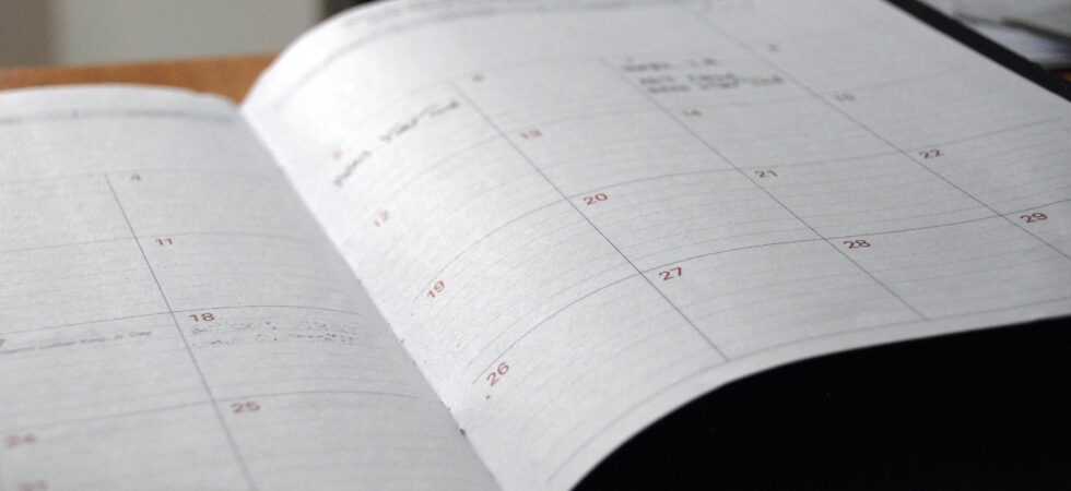 An bound but open daily calendar with plenty of space for notes.